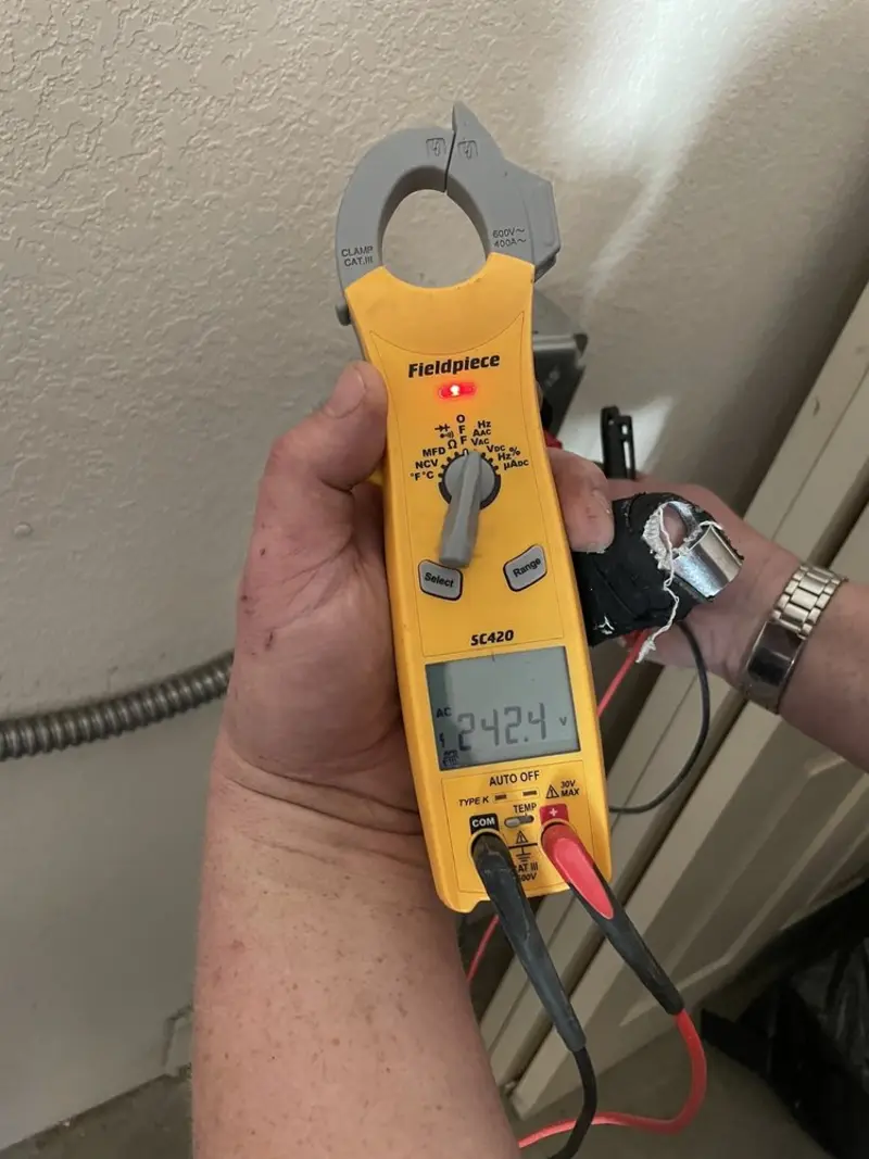 Voltage testing with clamp meter during Aluminum Wiring Replacement in Jasper
